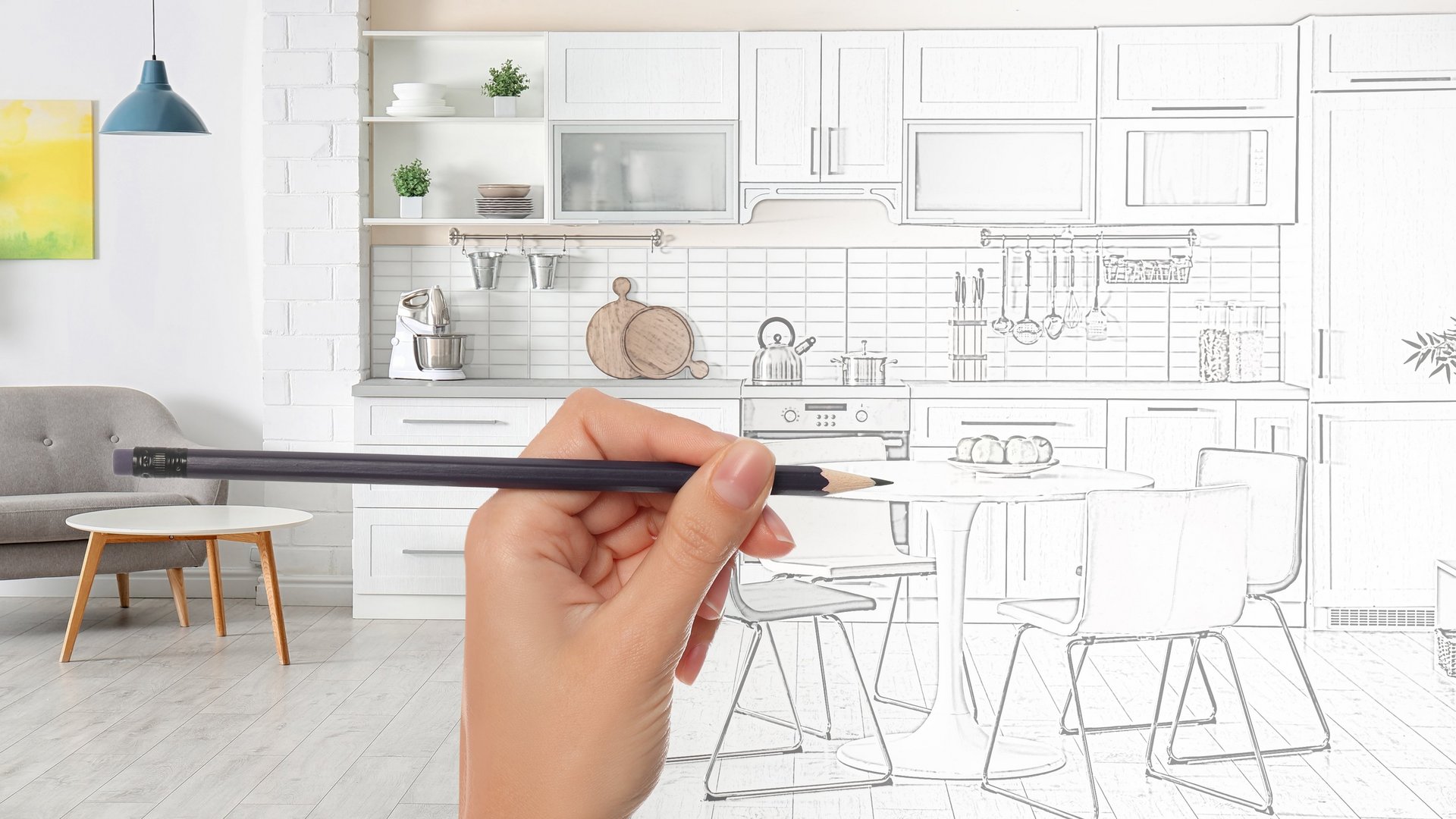 Küchenplanung leicht gemacht Eine Hand hält einen Bleistift und skizziert eine Küchenplanung