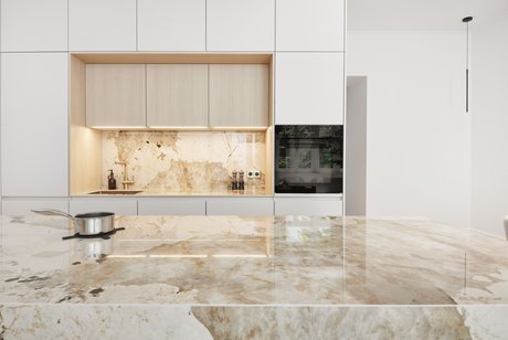 Die Kücheninsel ist ein beeindruckender Blickfang: Eine Keramikarbeitsplatte mit einer edlen Musterung.